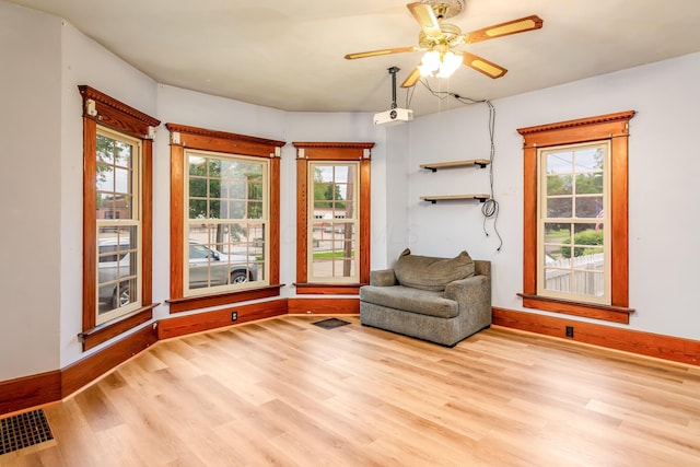 302 Oak St, Mount Vernon, OH 43050 - sitting room featuring wood finished floors, healthy amount of natural light, ceiling fan, and baseboards
