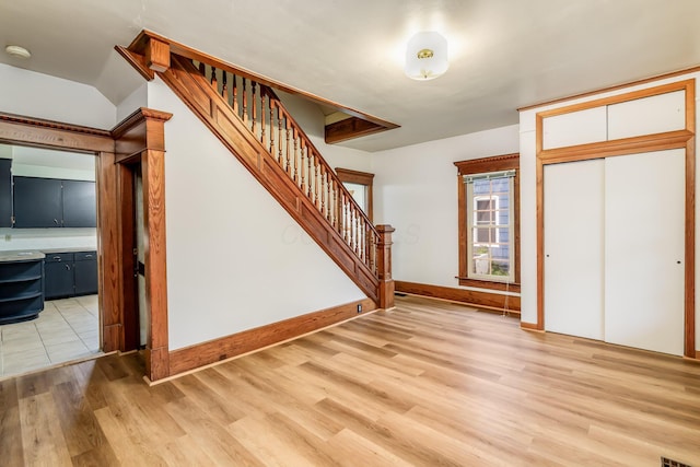 302 Oak St, Mount Vernon, OH 43050 - foyer entrance with stairway, light wood-type flooring, and baseboards