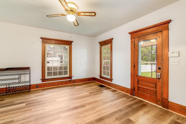 302 Oak St, Mount Vernon, OH 43050 - entrance foyer with wood finished floors, ceiling fan, and baseboards
