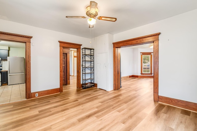 302 Oak St, Mount Vernon, OH 43050 - unfurnished room with baseboards, light wood finished floors, and ceiling fan