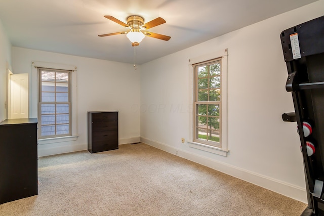 302 Oak St, Mount Vernon, OH 43050 - unfurnished bedroom featuring baseboards, carpet, and ceiling fan