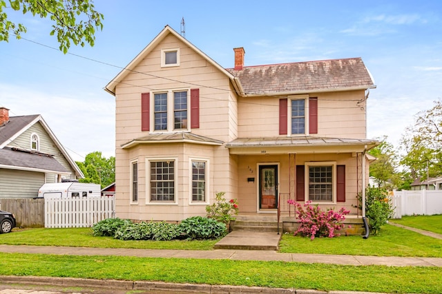 302 Oak St, Mount Vernon, OH 43050 - view of front of house featuring a standing seam roof, a porch, metal roof, and a chimney