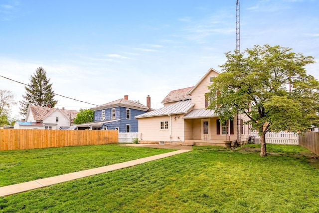 302 Oak St, Mount Vernon, OH 43050 - back of property with a standing seam roof, metal roof, and covered porch