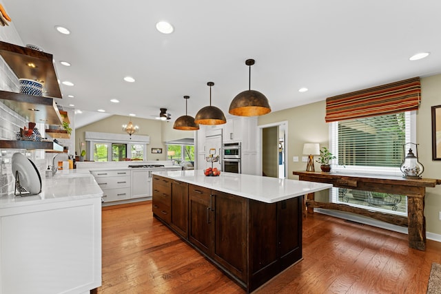 5518 Aryshire Ct, Dublin, OH 43017 - kitchen featuring light countertops, light wood finished floors, white cabinetry, open shelves, and recessed lighting