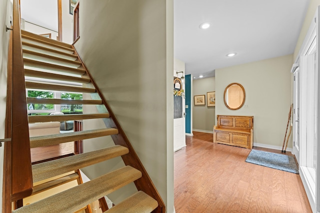 5518 Aryshire Ct, Dublin, OH 43017 - staircase with wood finished floors, recessed lighting, and baseboards