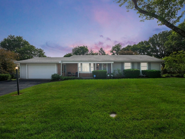 954 Circle Dr, Circleville, OH 43113 - single story home featuring a garage, driveway, and a lawn