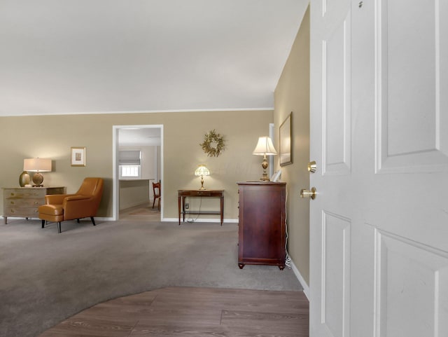 954 Circle Dr, Circleville, OH 43113 - foyer featuring carpet flooring, wood finished floors, and ornamental molding