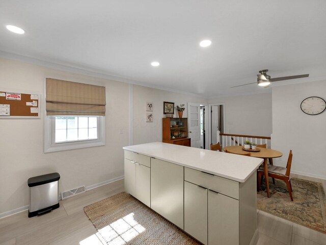 954 Circle Dr, Circleville, OH 43113 - kitchen with light countertops, ceiling fan, a peninsula, recessed lighting, and ornamental molding