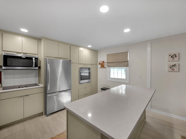 954 Circle Dr, Circleville, OH 43113 - kitchen featuring stainless steel appliances, cream cabinets, tasteful backsplash, recessed lighting, and a center island