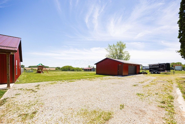 1674 Brock Rd NE, Bloomingburg, OH 43106 - view of pole building featuring a playground and a yard
