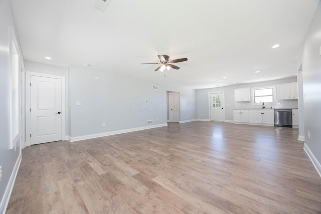 1674 Brock Rd NE, Bloomingburg, OH 43106 - unfurnished living room with ceiling fan, light wood-style floors, a sink, baseboards, and recessed lighting
