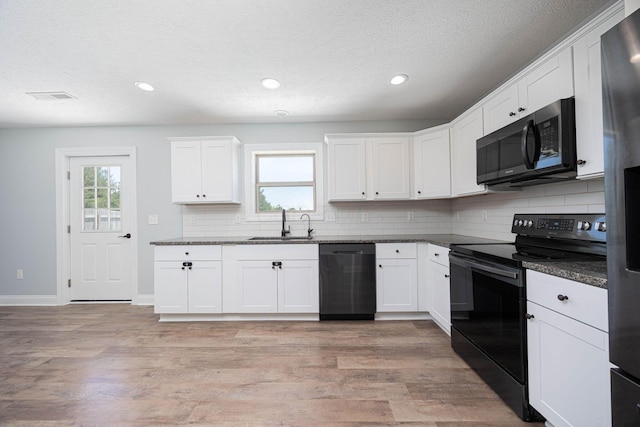 1674 Brock Rd NE, Bloomingburg, OH 43106 - kitchen featuring dishwasher, black / electric stove, a sink, tasteful backsplash, and recessed lighting