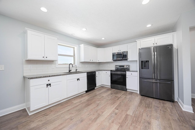 1674 Brock Rd NE, Bloomingburg, OH 43106 - kitchen with stainless steel appliances, a sink, baseboards, decorative backsplash, and recessed lighting