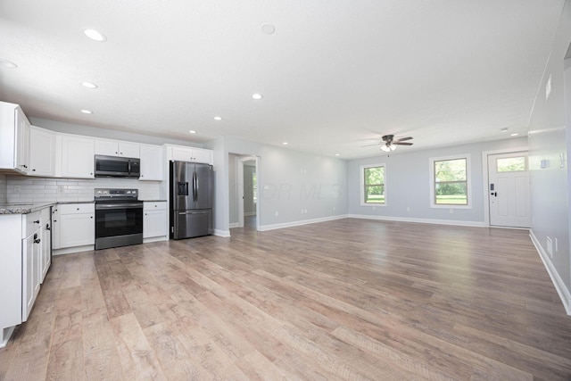 1674 Brock Rd NE, Bloomingburg, OH 43106 - kitchen with stainless steel appliances, ceiling fan, recessed lighting, white cabinets, and light wood-style floors