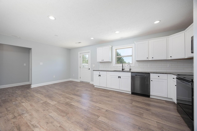 1674 Brock Rd NE, Bloomingburg, OH 43106 - kitchen featuring dishwashing machine, black range with electric cooktop, a sink, decorative backsplash, and dark countertops