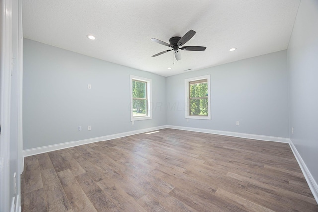 1674 Brock Rd NE, Bloomingburg, OH 43106 - spare room featuring a ceiling fan, wood finished floors, baseboards, recessed lighting, and a textured ceiling