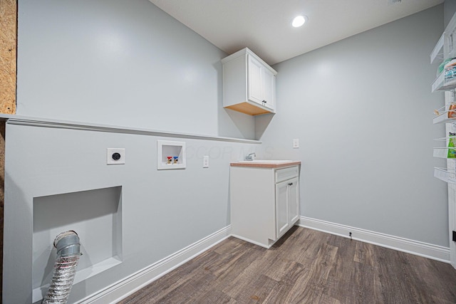 1674 Brock Rd NE, Bloomingburg, OH 43106 - laundry room featuring electric dryer hookup, dark wood-style flooring, hookup for a washing machine, cabinet space, and baseboards