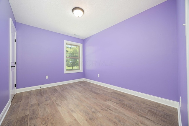 1674 Brock Rd NE, Bloomingburg, OH 43106 - unfurnished room featuring wood finished floors and baseboards