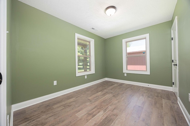 1674 Brock Rd NE, Bloomingburg, OH 43106 - unfurnished room with wood finished floors and baseboards