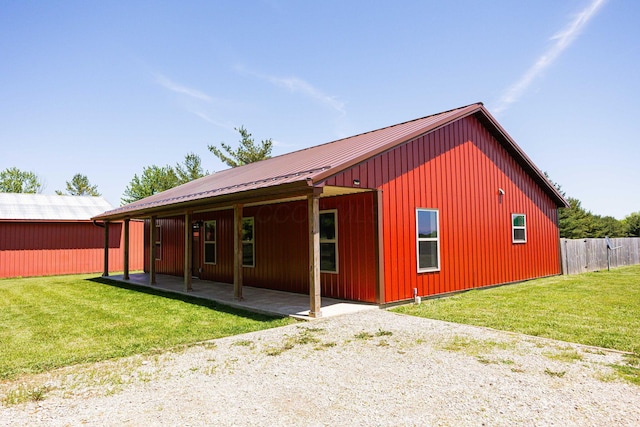 1674 Brock Rd NE, Bloomingburg, OH 43106 - back of house featuring metal roof and a patio area