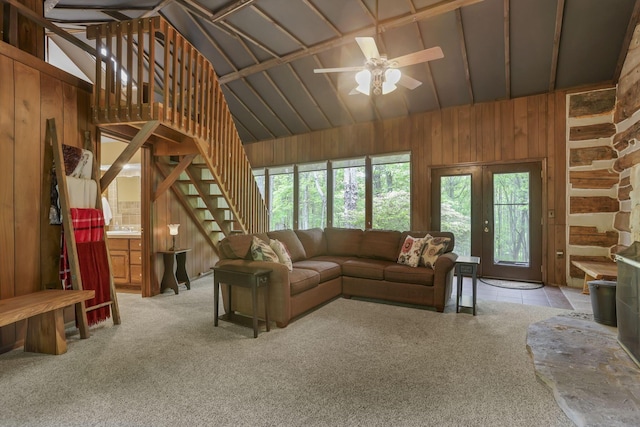 13115 Jack Run Rd, Rockbridge, OH 43149 - carpeted living area with healthy amount of natural light, wooden walls, vaulted ceiling, and a ceiling fan
