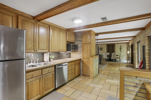 13115 Jack Run Rd, Rockbridge, OH 43149 - kitchen featuring appliances with stainless steel finishes, a sink, beamed ceiling, tasteful backsplash, and light countertops