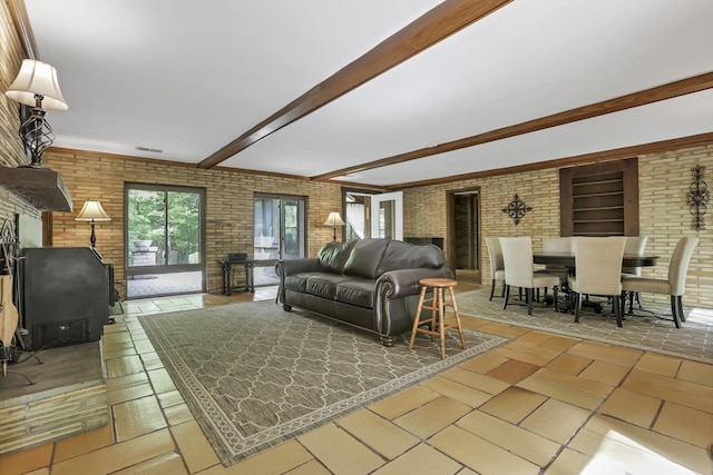 13115 Jack Run Rd, Rockbridge, OH 43149 - living room featuring brick wall and beamed ceiling