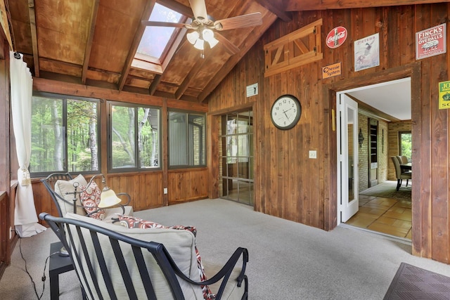 13115 Jack Run Rd, Rockbridge, OH 43149 - sunroom featuring wooden walls, ceiling fan, a skylight, carpet, and beamed ceiling