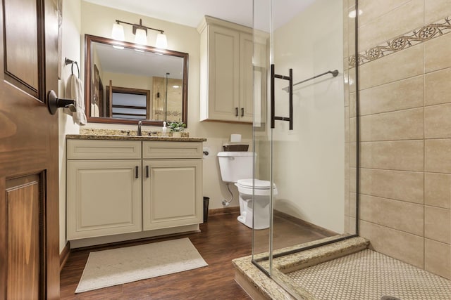 13115 Jack Run Rd, Rockbridge, OH 43149 - bathroom with a stall shower, toilet, wood finished floors, vanity, and baseboards