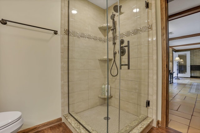 13115 Jack Run Rd, Rockbridge, OH 43149 - full bathroom featuring a stall shower, toilet, and baseboards