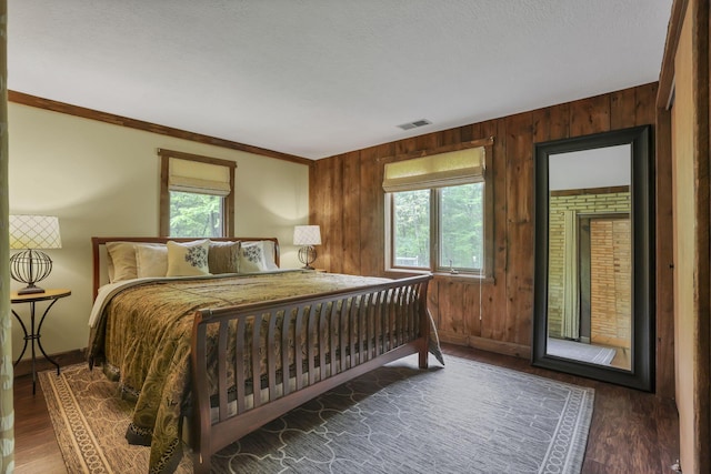 13115 Jack Run Rd, Rockbridge, OH 43149 - bedroom featuring baseboards, wooden walls, wood finished floors, and ornamental molding