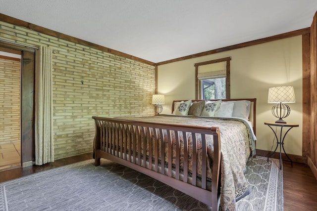 13115 Jack Run Rd, Rockbridge, OH 43149 - bedroom featuring brick wall, wood finished floors, and baseboards