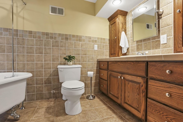 13115 Jack Run Rd, Rockbridge, OH 43149 - full bath with tile walls, vanity, toilet, tile patterned flooring, and wainscoting