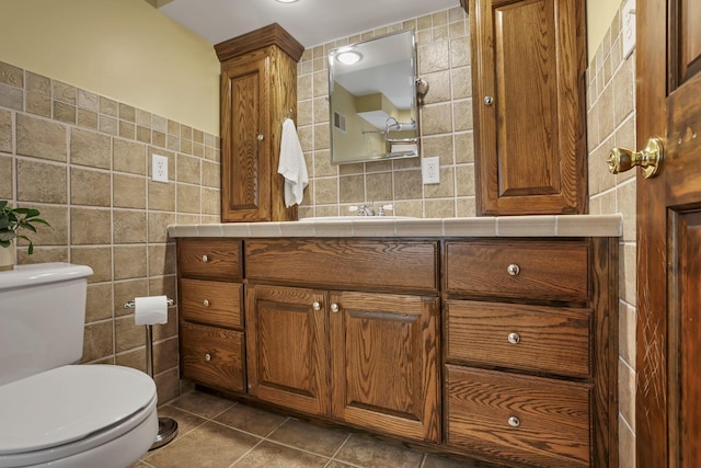 13115 Jack Run Rd, Rockbridge, OH 43149 - half bath with tile walls, vanity, toilet, and tile patterned flooring