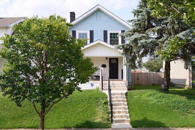 258 E Welch Ave, Columbus, OH 43207 - view of front of property with board and batten siding, a chimney, and a porch