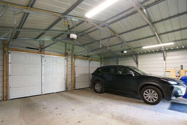 258 E Welch Ave, Columbus, OH 43207 - garage featuring metal wall and a garage door opener