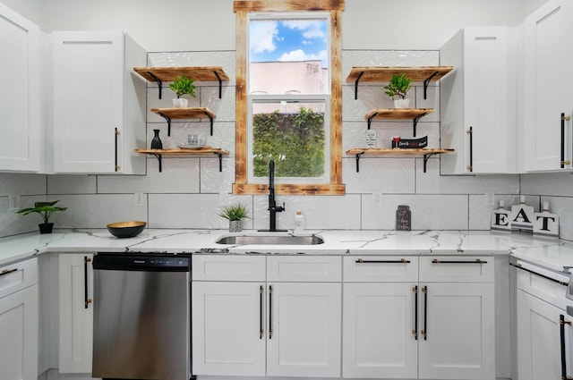 525 Saint Clair Ave, Columbus, OH 43203 - kitchen featuring stainless steel dishwasher, open shelves, a sink, and white cabinetry