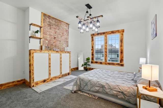 525 Saint Clair Ave, Columbus, OH 43203 - carpeted bedroom featuring a chandelier and baseboards