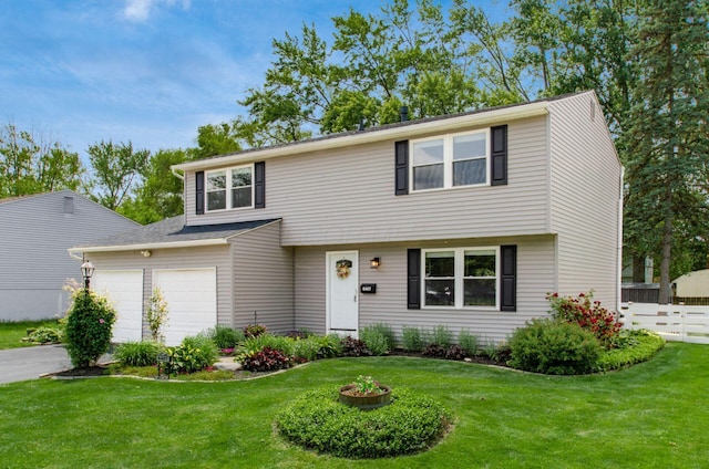 6407 Skywae Dr, Columbus, OH 43229 - colonial house with asphalt driveway and an attached garage