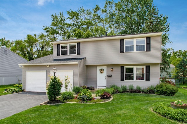 6407 Skywae Dr, Columbus, OH 43229 - view of front facade with asphalt driveway, a front yard, and an attached garage