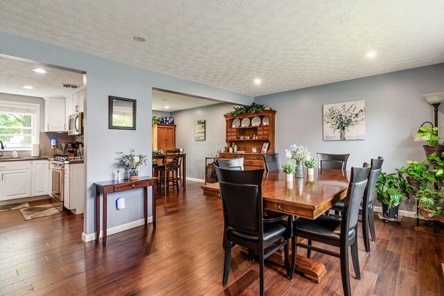 6407 Skywae Dr, Columbus, OH 43229 - dining room featuring dark wood-style floors, baseboards, recessed lighting, and a textured ceiling