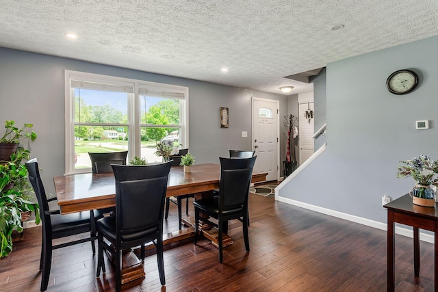 6407 Skywae Dr, Columbus, OH 43229 - dining room featuring dark wood-style flooring, a textured ceiling, recessed lighting, and baseboards