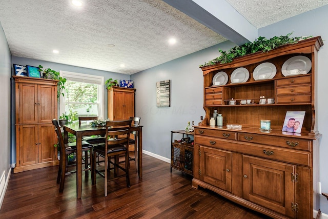 6407 Skywae Dr, Columbus, OH 43229 - dining room featuring a textured ceiling, dark wood-style floors, recessed lighting, and baseboards