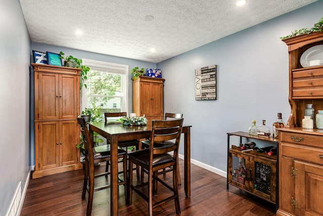 6407 Skywae Dr, Columbus, OH 43229 - dining space with dark wood-style flooring, baseboards, recessed lighting, and a textured ceiling