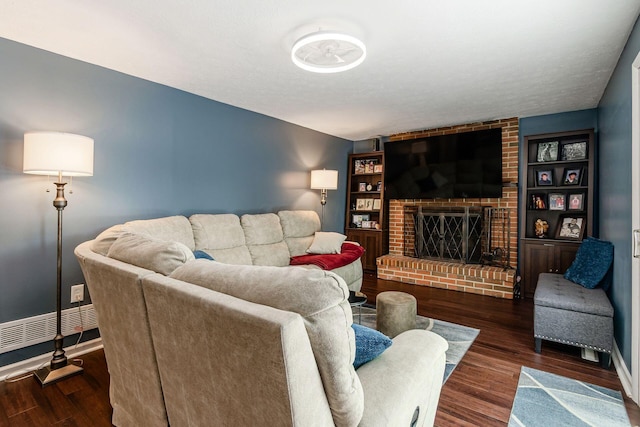 6407 Skywae Dr, Columbus, OH 43229 - living area with wood finished floors, baseboards, and a brick fireplace