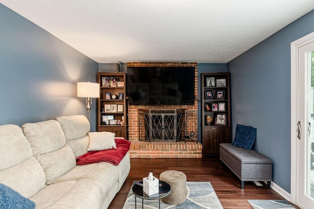 6407 Skywae Dr, Columbus, OH 43229 - living area with a brick fireplace, wood finished floors, and baseboards