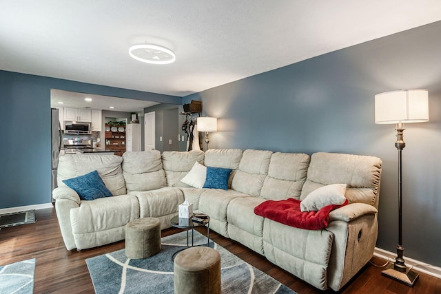 6407 Skywae Dr, Columbus, OH 43229 - living room featuring baseboards, dark wood-style floors, and recessed lighting