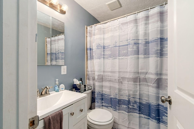 6407 Skywae Dr, Columbus, OH 43229 - full bathroom with vanity, a textured ceiling, and toilet