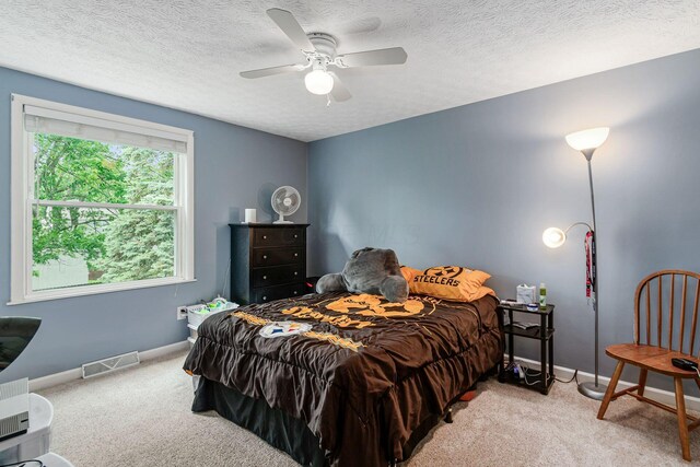 6407 Skywae Dr, Columbus, OH 43229 - bedroom featuring light carpet, a ceiling fan, baseboards, and a textured ceiling