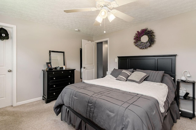 6407 Skywae Dr, Columbus, OH 43229 - bedroom featuring light carpet, a textured ceiling, a ceiling fan, and baseboards